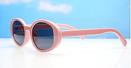 The Freya medium retro oval UV400 sunglasses in translucent or solid colours with super dark lenses