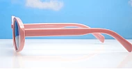 The Freya medium retro oval UV400 sunglasses in translucent or solid colours with super dark lenses