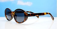 The Freya medium retro oval UV400 sunglasses in translucent or solid colours with super dark lenses