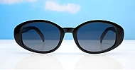The Freya medium retro oval UV400 sunglasses in translucent or solid colours with super dark lenses