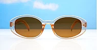 The Freya medium retro oval UV400 sunglasses in translucent or solid colours with super dark lenses