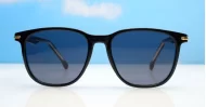 The Canyon unisex round UV400 sunglasses in black with coloured pinstripe, gold accents and dark grey Category 3 lenses