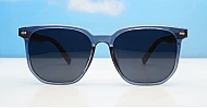 Ari Grey polarised sunglasses with grey frames dark grey lenses and faux wood temples