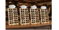 Laser-cut wooden sunglasses display stand with mirrored top