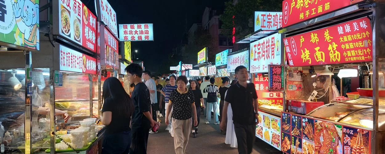 Busy night market in China visited during an iPOP eyewear sourcing trip