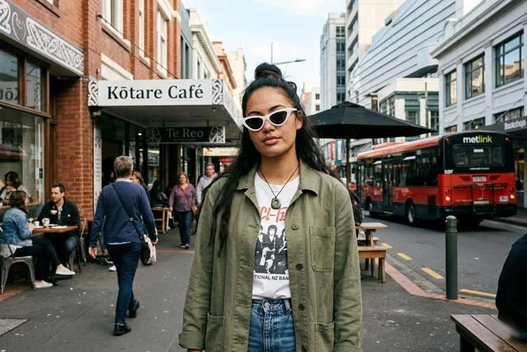 Young woman wearing white cat-eye sunglasses in NZ