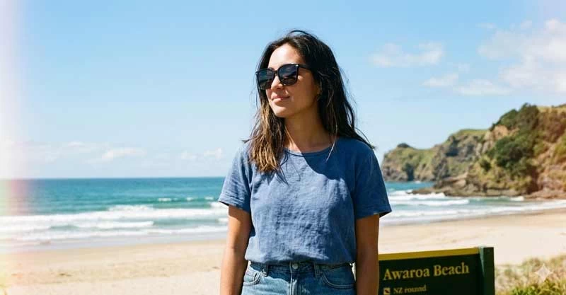 Woman wearing iPOP cheap sunglasses on a NZ beach