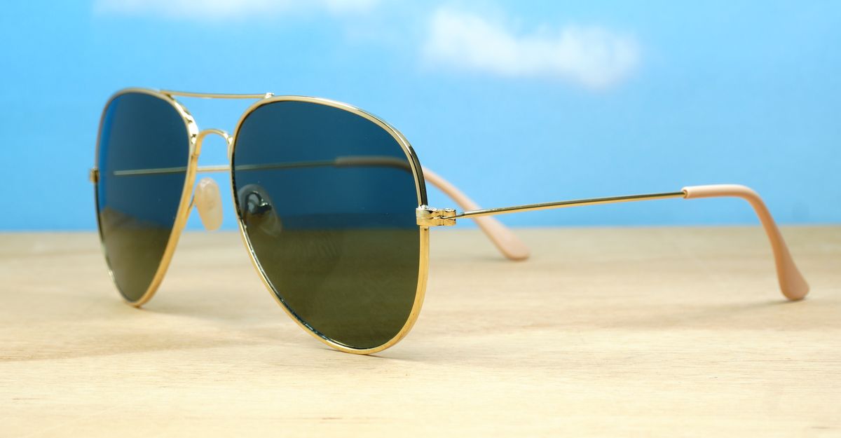 The Superdark Aviator UV400 sunglasses with sleek gold metal frames and dark glass lenses