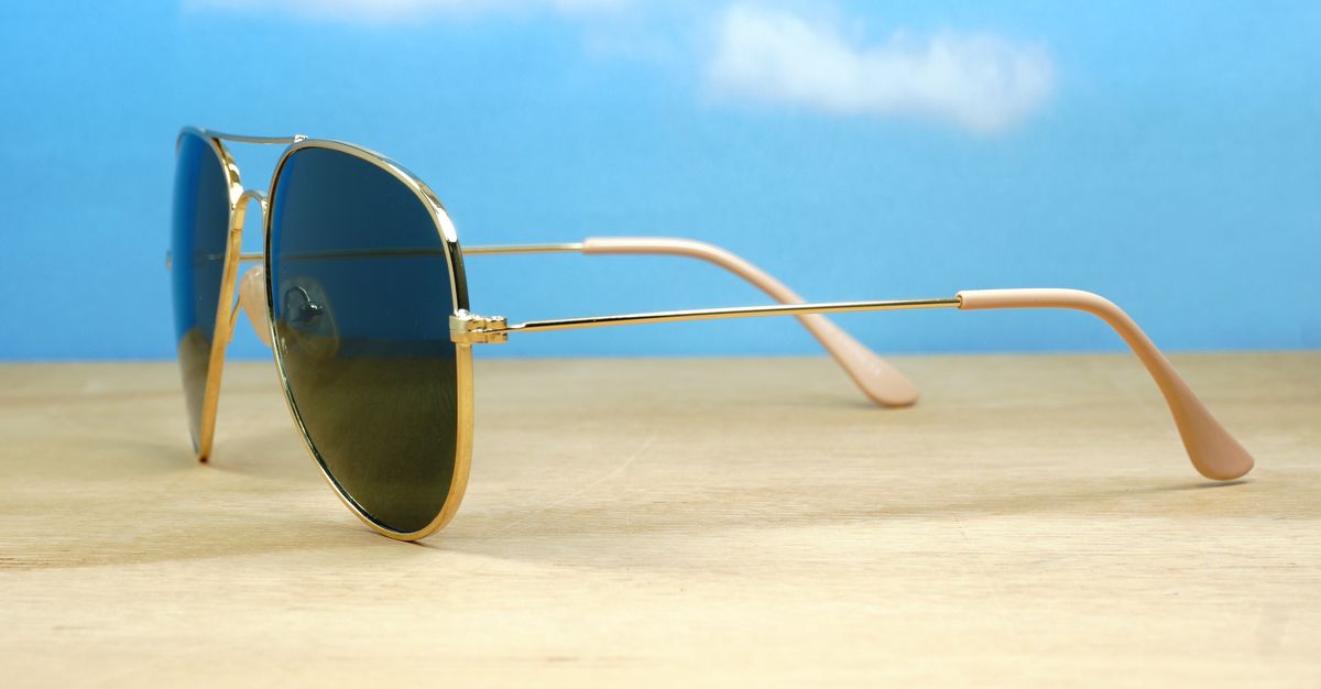 The Superdark Aviator UV400 sunglasses with sleek gold metal frames and dark glass lenses