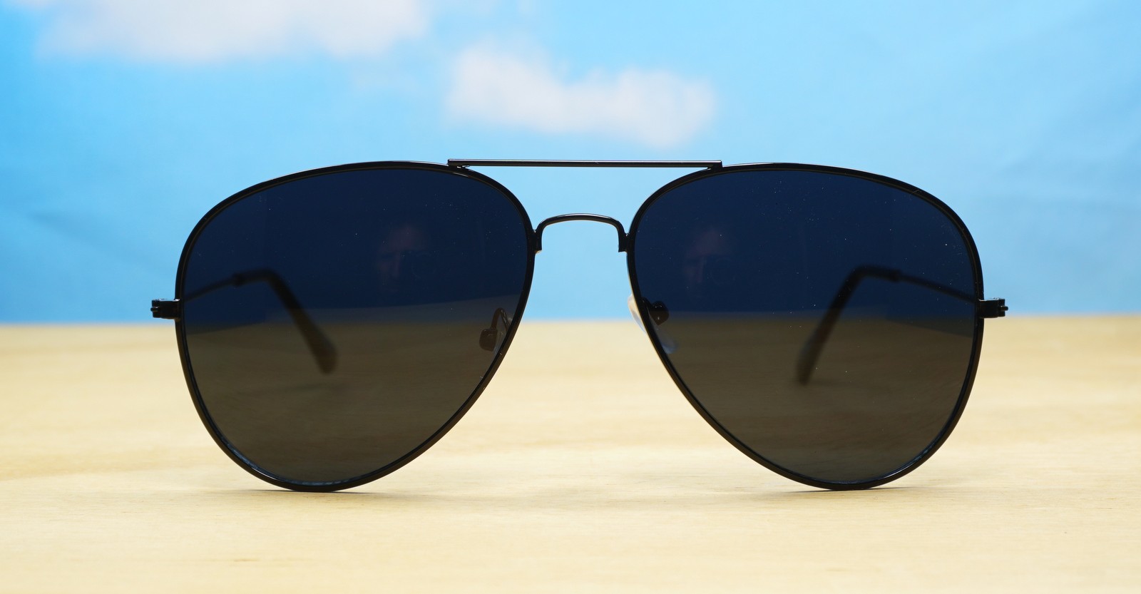 The Superdark Aviator UV400 sunglasses with sleek gold metal frames and dark glass lenses