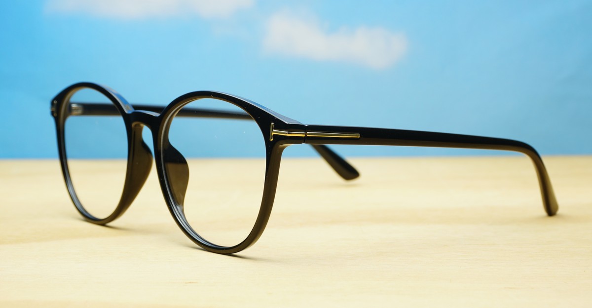 Black computer glasses with gold accents and blue light lenses