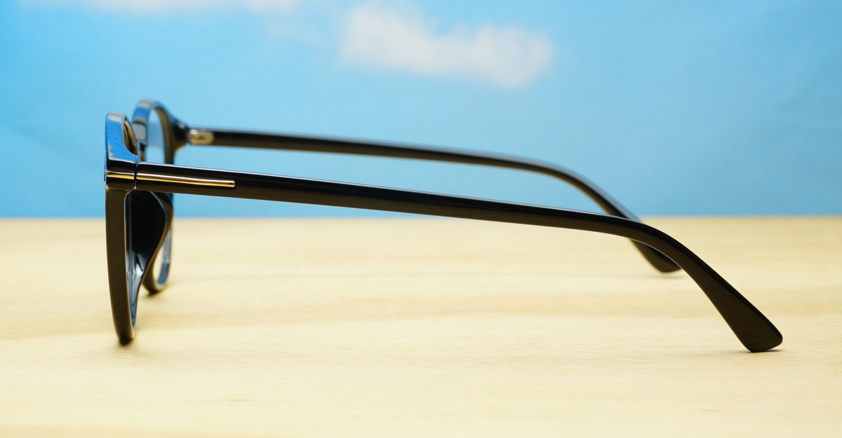 Black computer glasses with gold accents and blue light lenses
