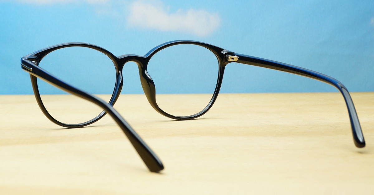 Black computer glasses with gold accents and blue light lenses