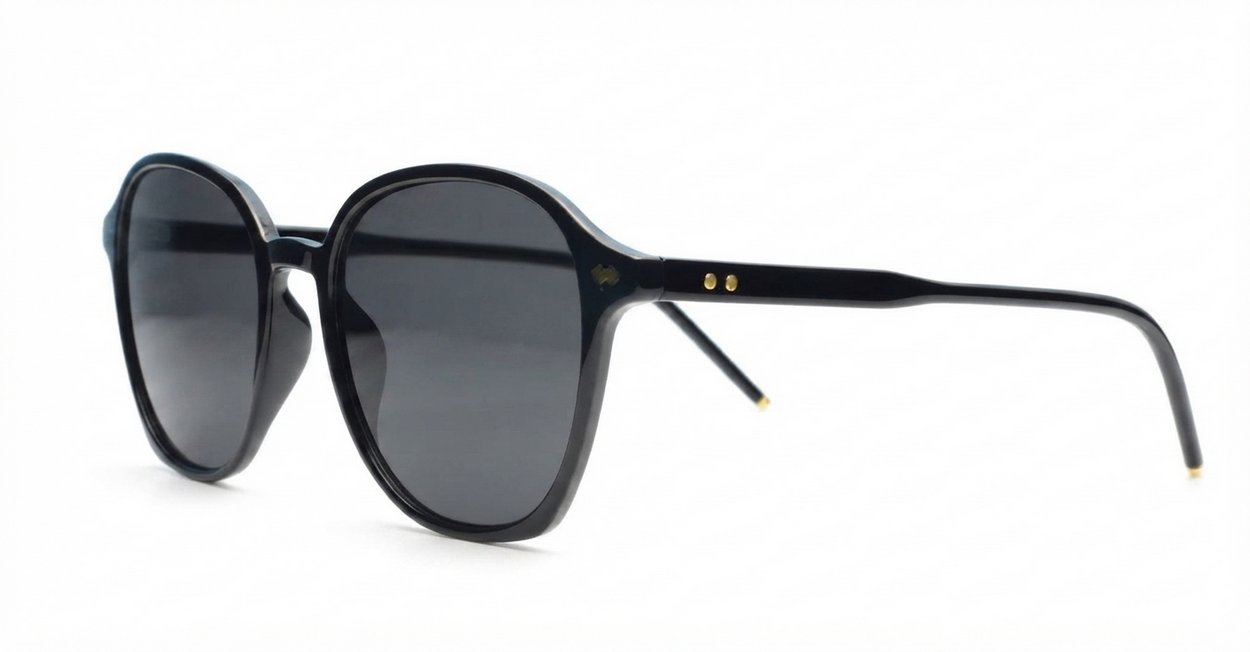 The Disco large round UV400 sunglasses in black with gold detailing and super dark lenses