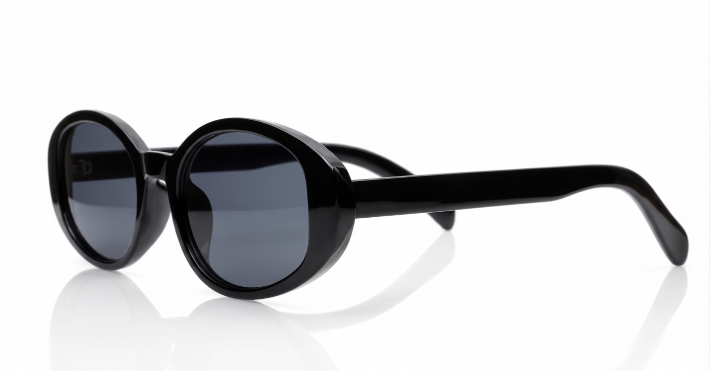 The Freya medium retro oval UV400 sunglasses in translucent or solid colours with super dark lenses